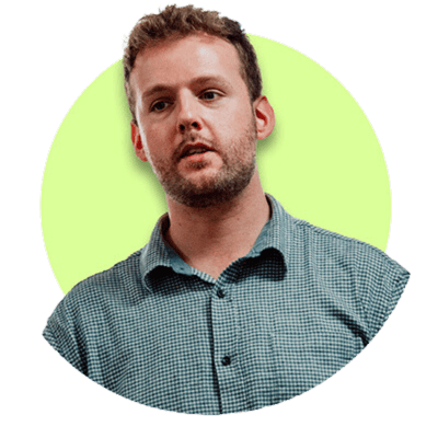 headshot of Nigel Fryatt wearing a grey shirt against a lime green background